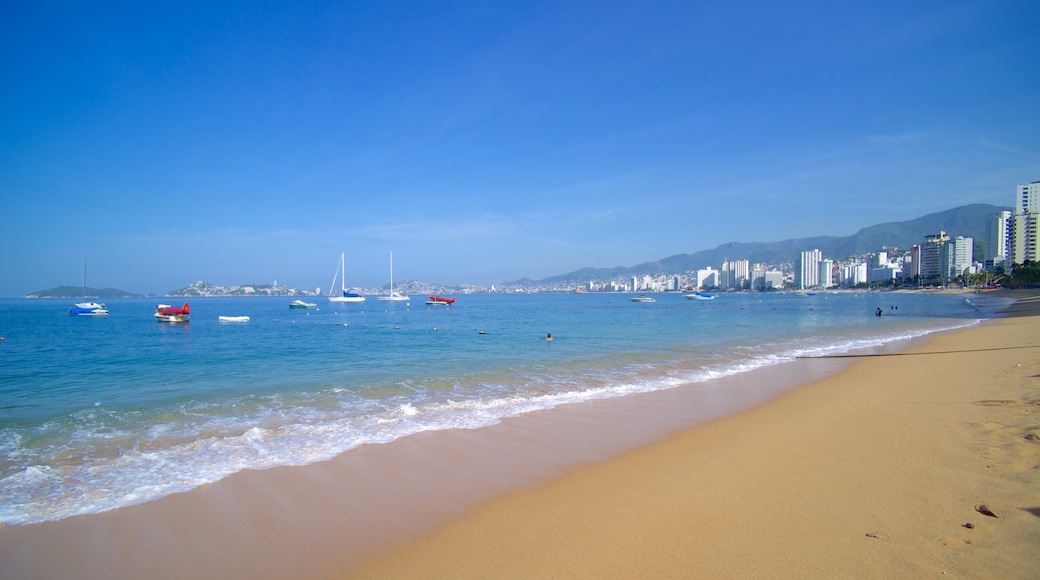 Icacos Beach showing a coastal town, a city and a beach