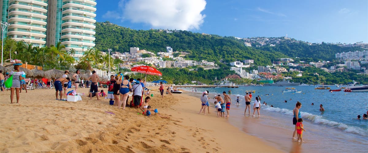 Icacos Beach which includes general coastal views, a sandy beach and tropical scenes