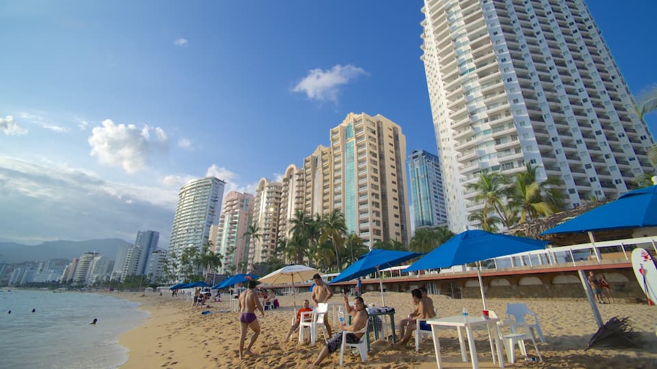 Icacos Beach featuring a sandy beach, a coastal town and a city