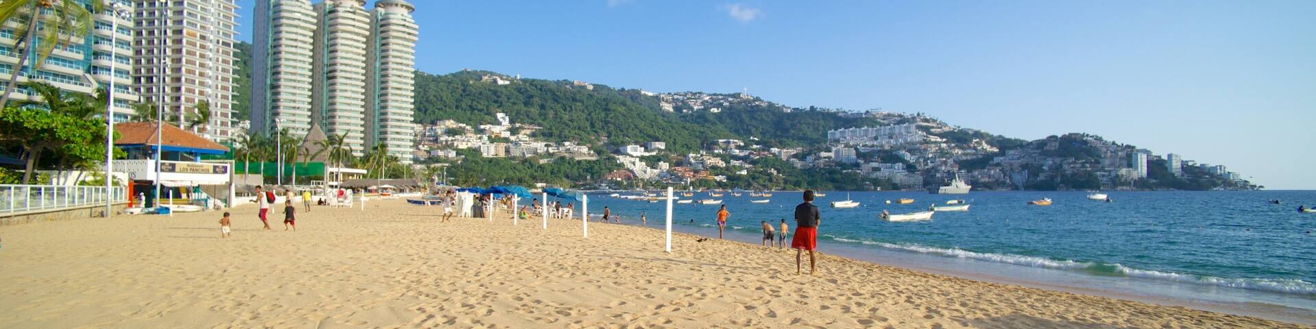 Icacos Beach featuring a beach, a coastal town and a city