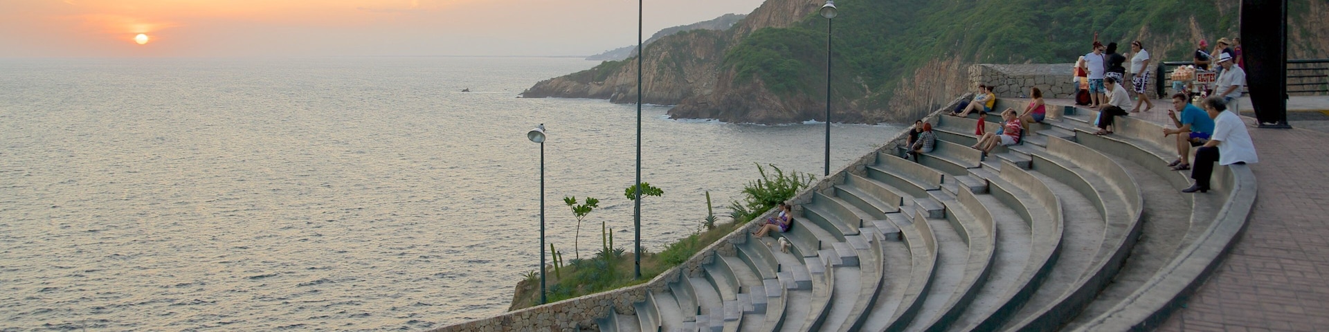 Sinfonia which includes general coastal views, a sunset and views
