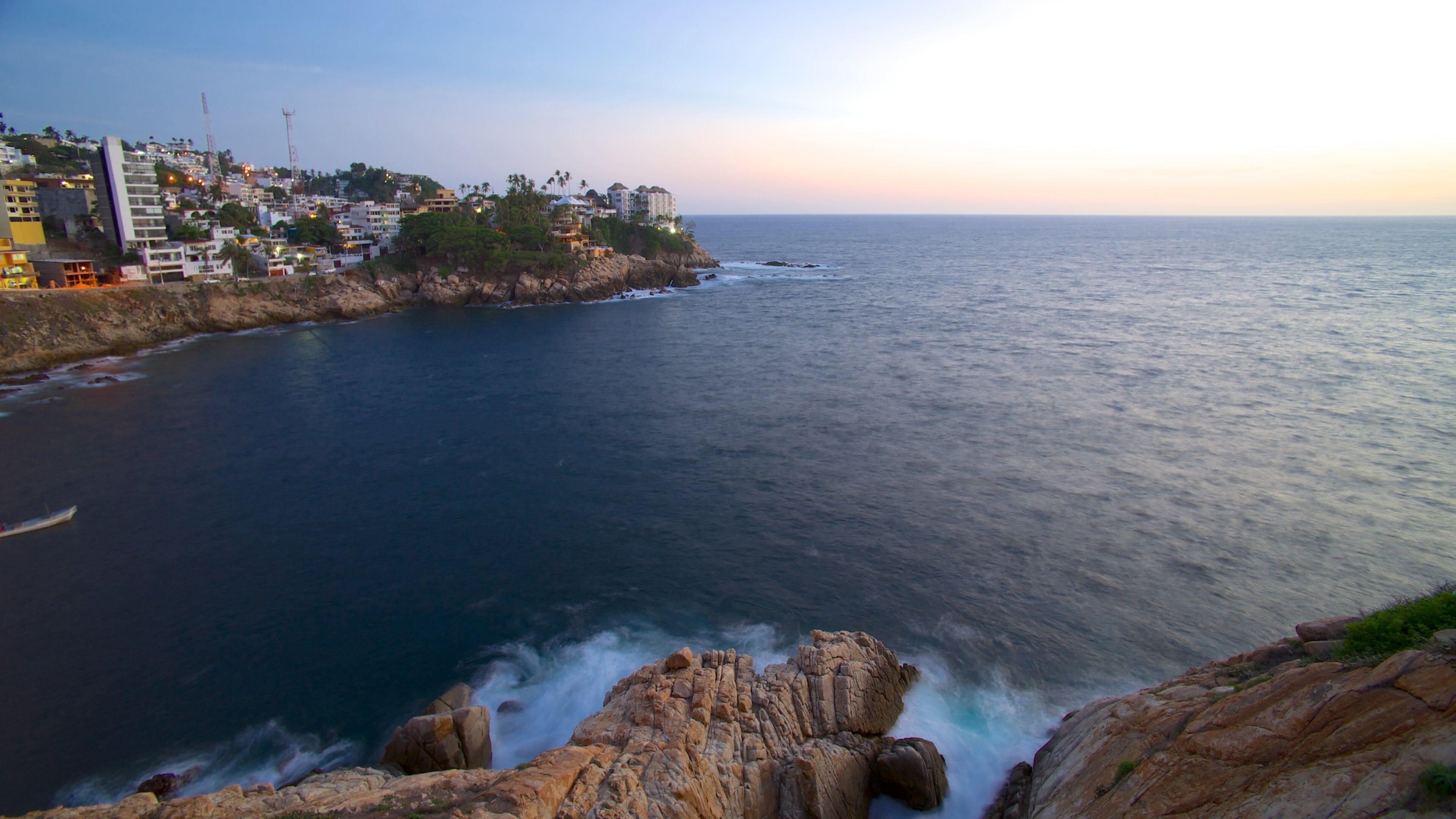 Sinfonia which includes a coastal town, rocky coastline and landscape views