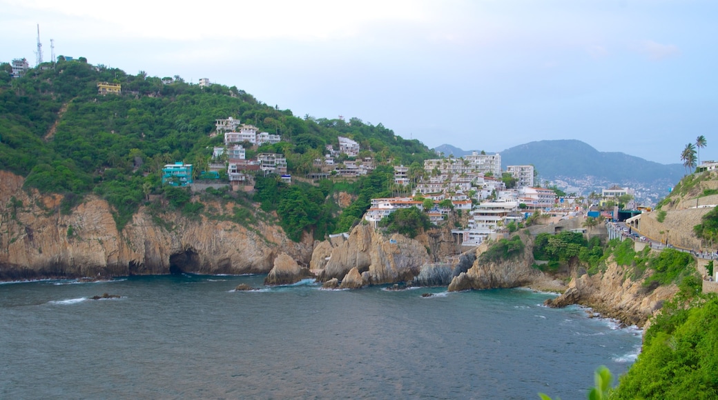 Sinfonia showing a coastal town, a gorge or canyon and rugged coastline