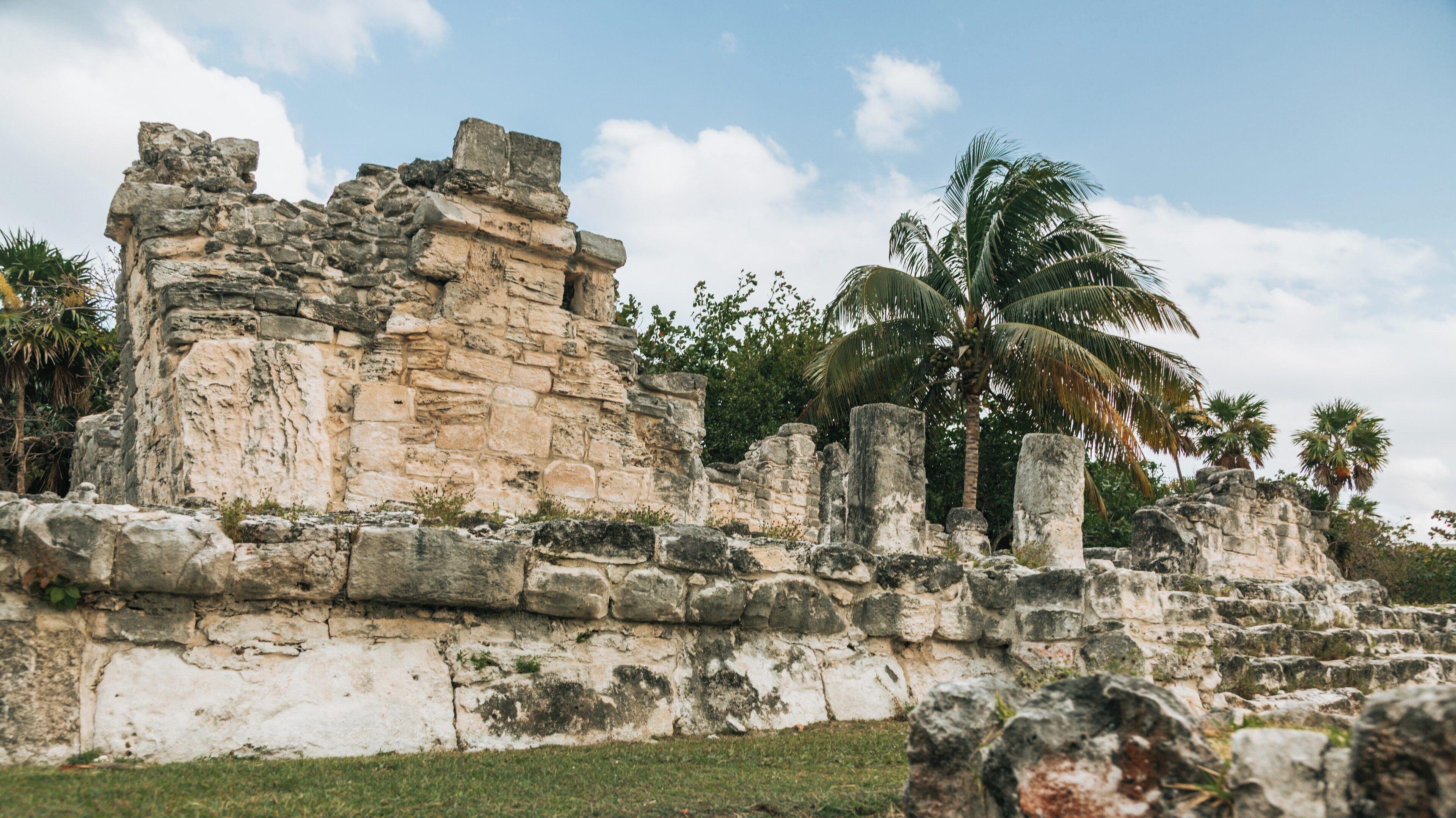 Exploring El Rey Ruins in the Zona Hotelera area of Cancun, Quintana Roo, Mexico, showcasing ancient Mayan architecture and lush tropical surroundings