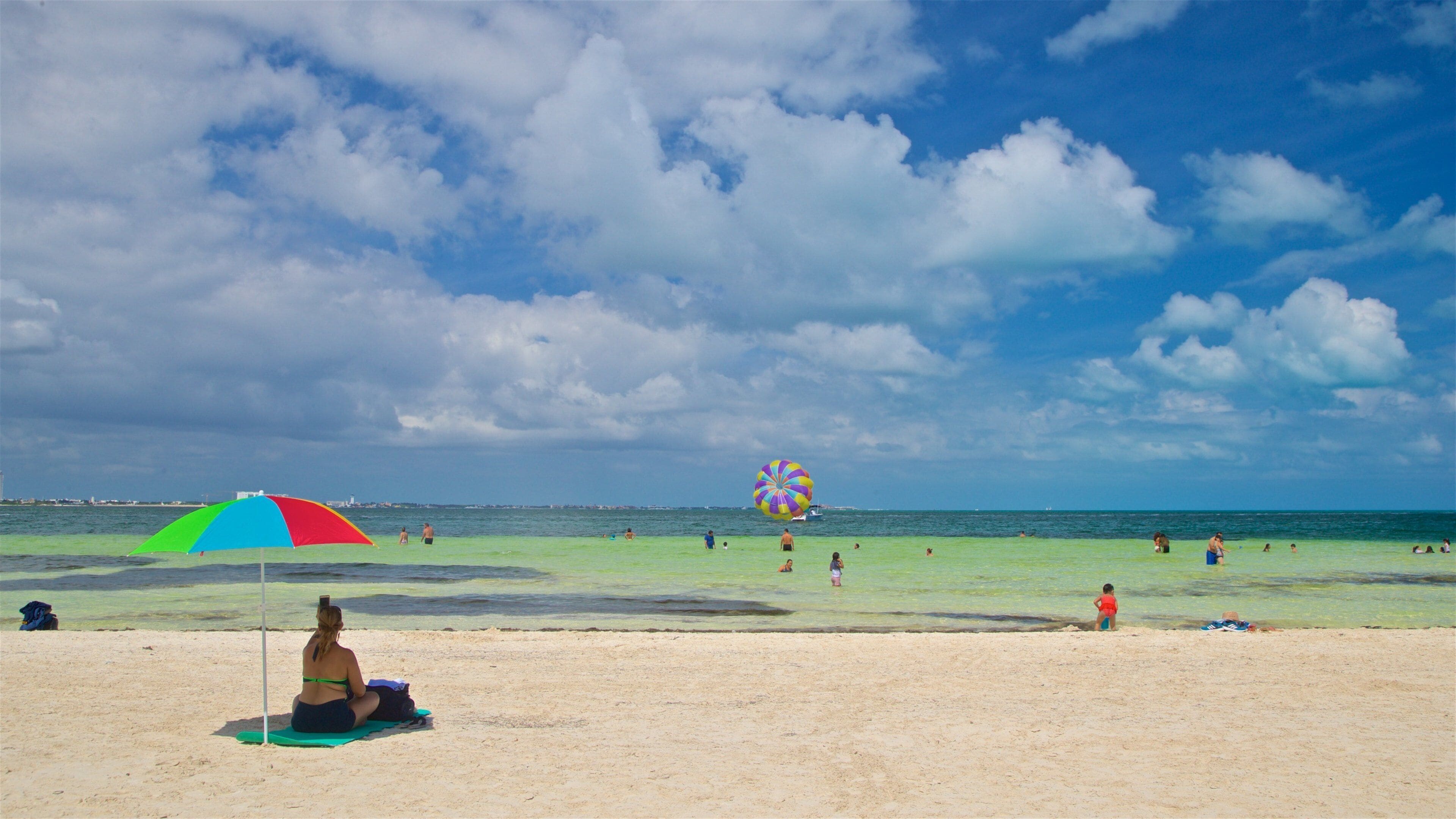 Playa Langosta mostrando vistas generales de la costa y una playa de arena y también una mujer