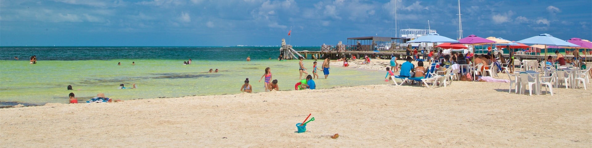 Playa Langosta showing general coastal views, swimming and a sandy beach
