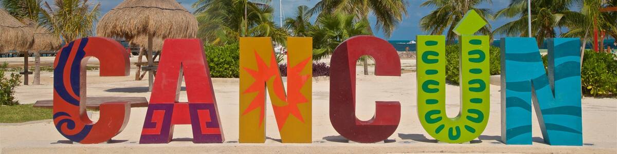 Playa Langosta which includes tropical scenes, outdoor art and signage