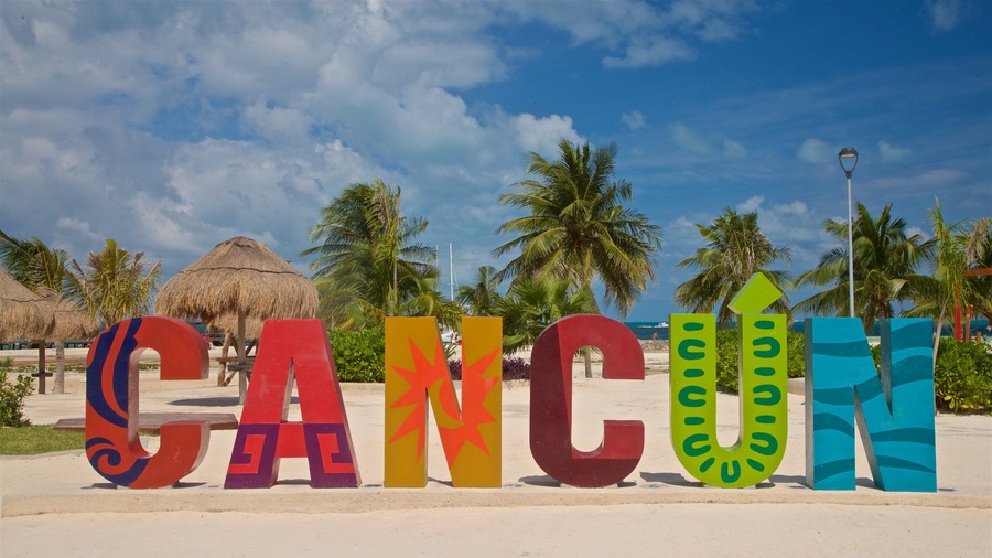 Playa Langosta showing outdoor art, tropical scenes and signage