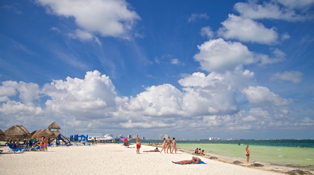 Langosta Beach which includes tropical scenes, a beach and general coastal views