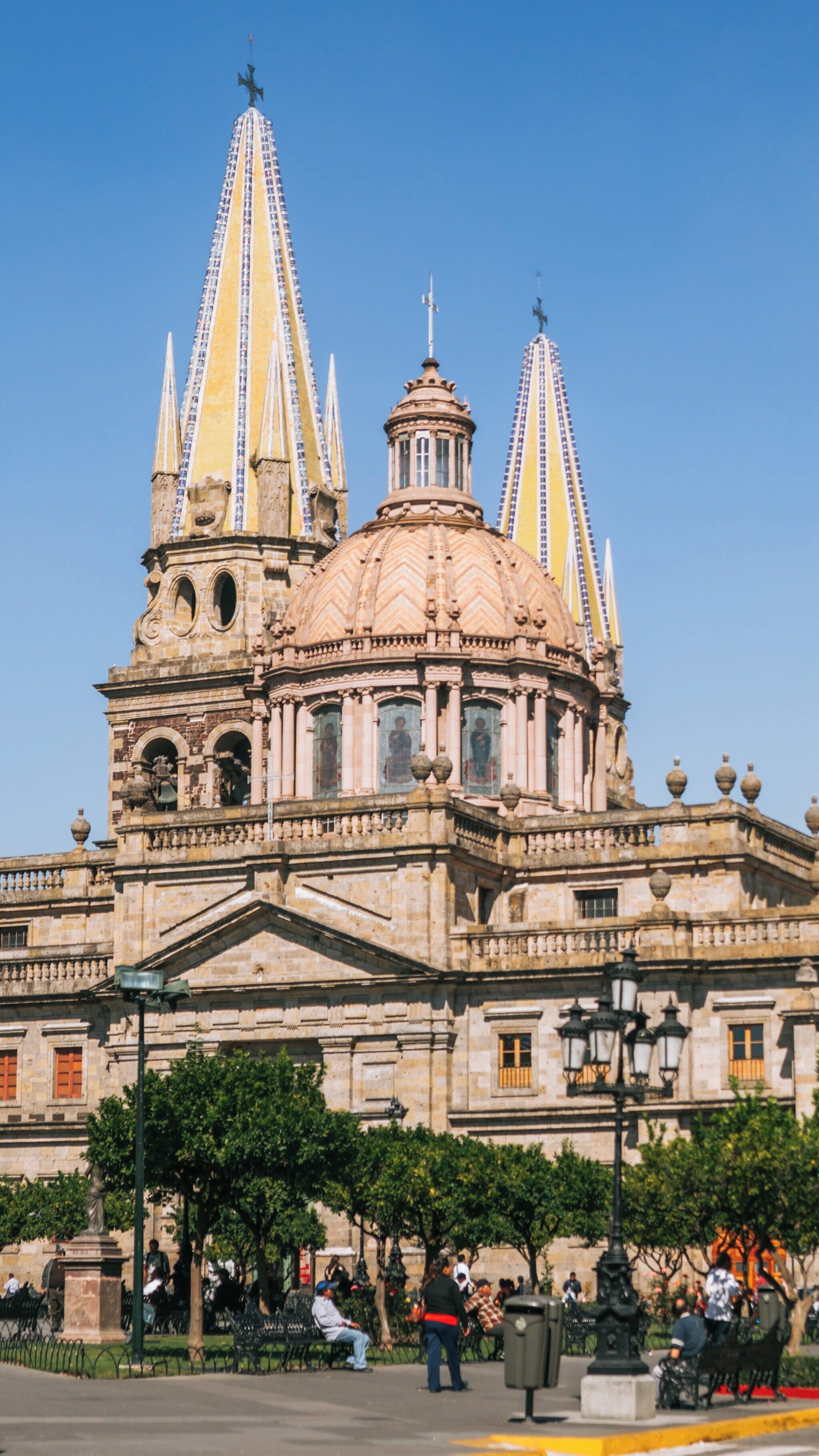Explore the stunning architecture of Plaza de Armas in Downtown Guadalajara, Jalisco, Mexico under a clear blue sky during a vibrant day