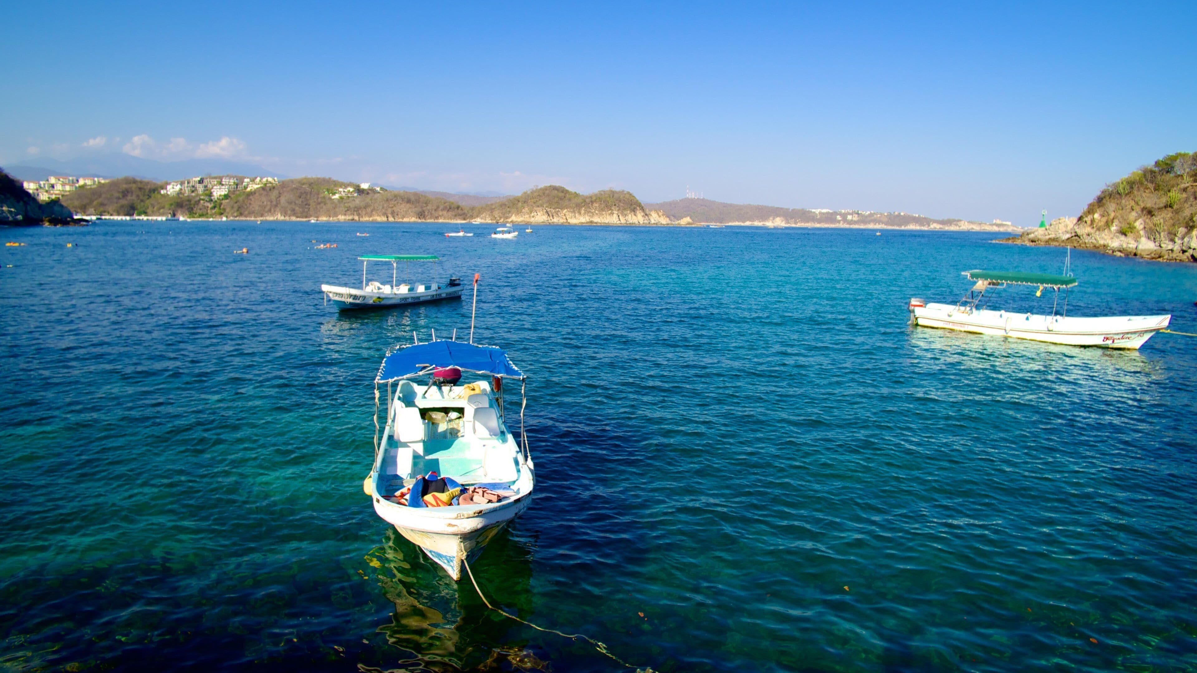 La Entrega Beach which includes landscape views, boating and general coastal views