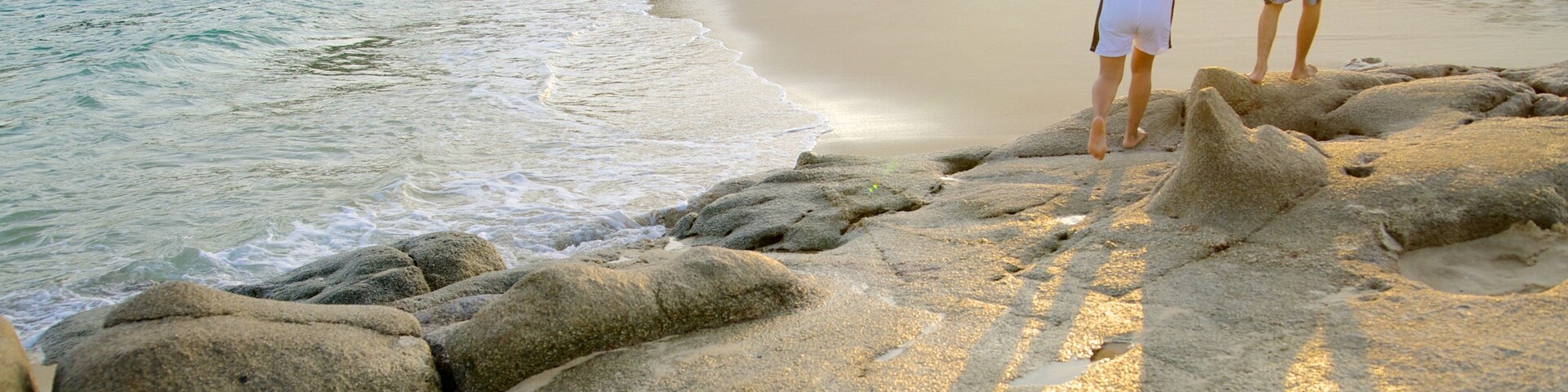Chahue Beach which includes a sunset and a sandy beach as well as a couple