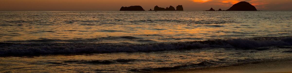 El Palmar Beach featuring a sunset, a beach and general coastal views