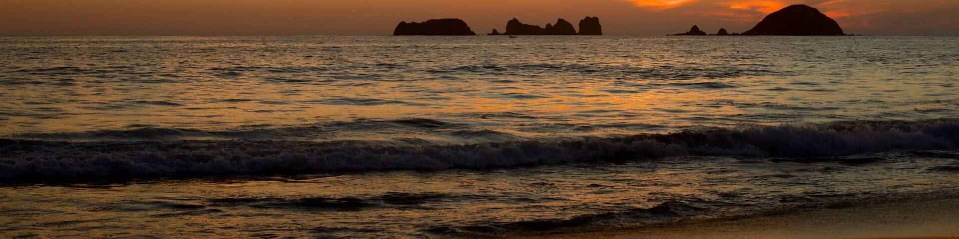 El Palmar Beach featuring a sunset, a beach and general coastal views