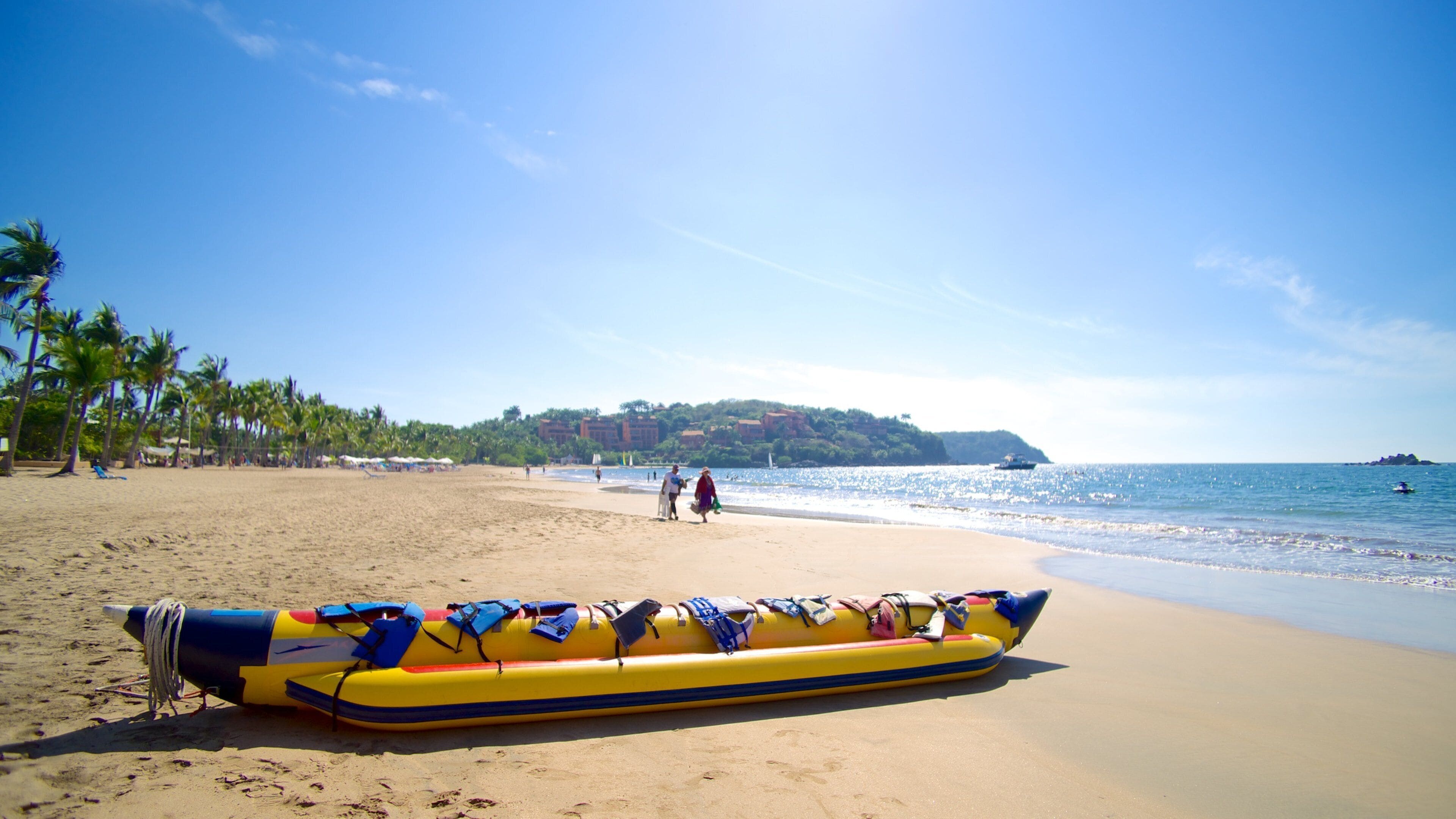 Quieta Beach featuring a sandy beach, landscape views and tropical scenes