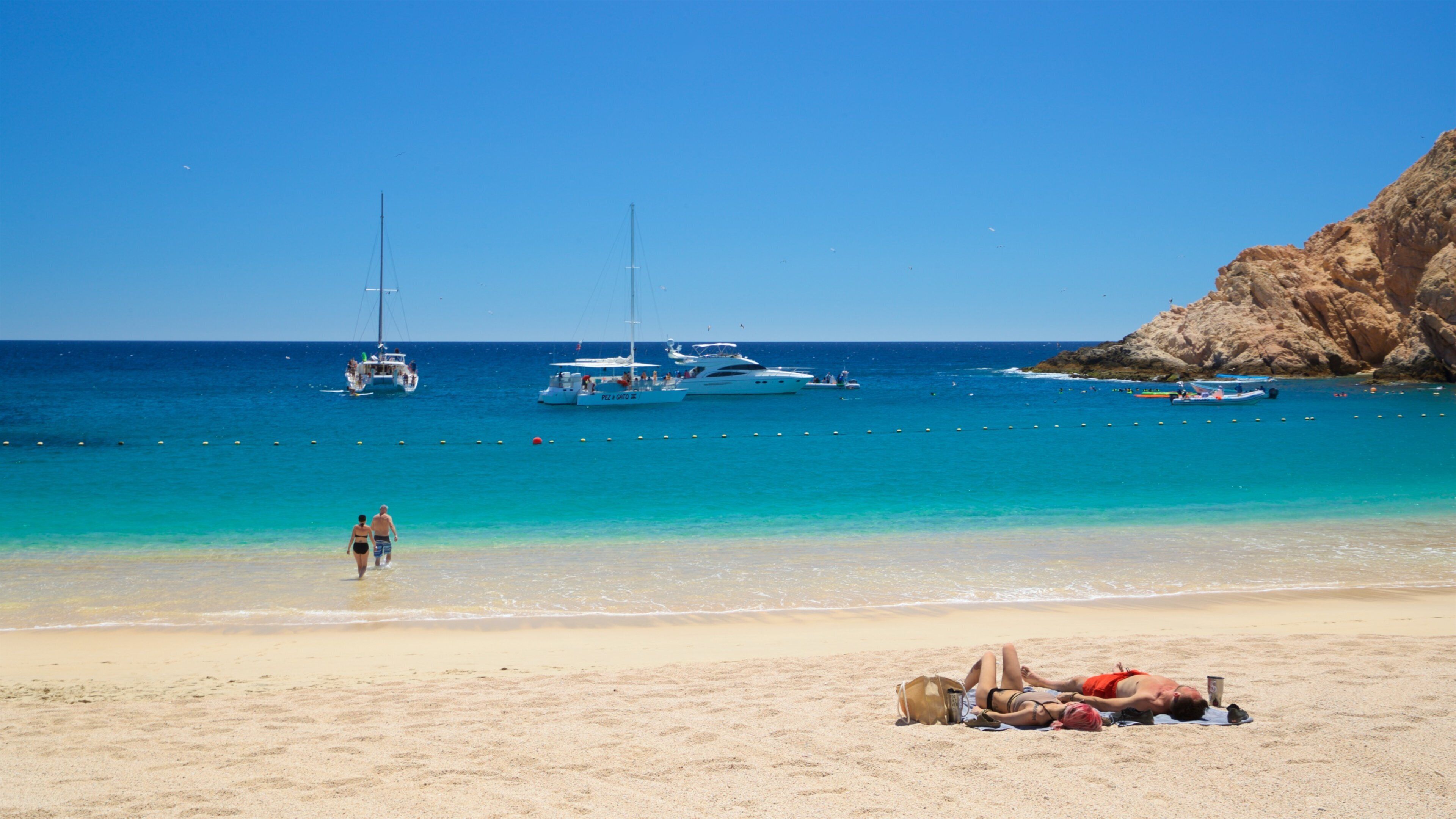 Santa Maria Beach showing general coastal views and a sandy beach as well as a couple