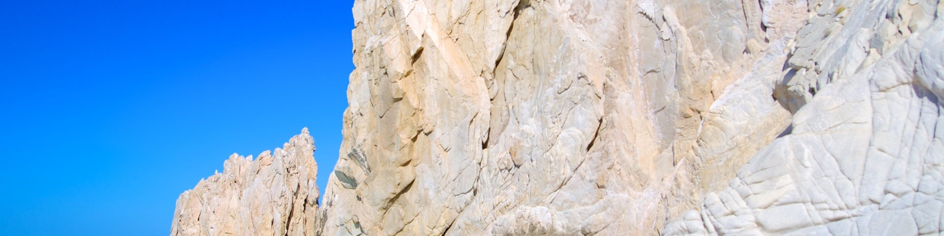 Playa del Amor which includes rocky coastline and a beach