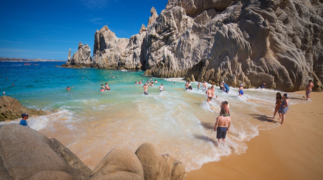 Playa del Amor which includes general coastal views, swimming and rugged coastline
