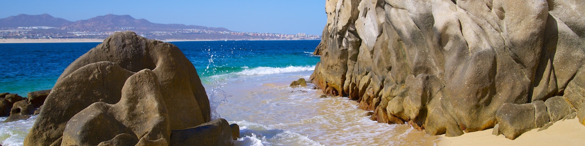 Playa del Amor showing rugged coastline and a beach