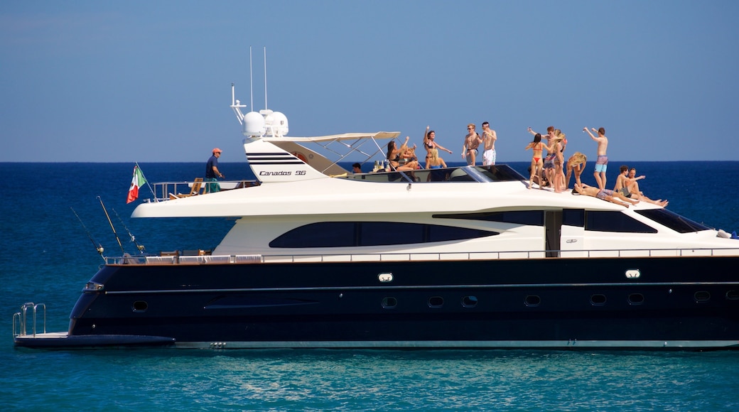 Chileno Beach which includes general coastal views and boating as well as a small group of people