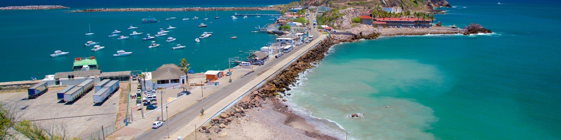 El Faro Lighthouse featuring general coastal views, mountains and rugged coastline