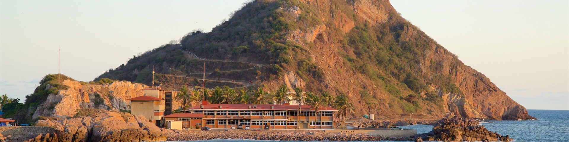 El Faro Lighthouse featuring mountains and general coastal views