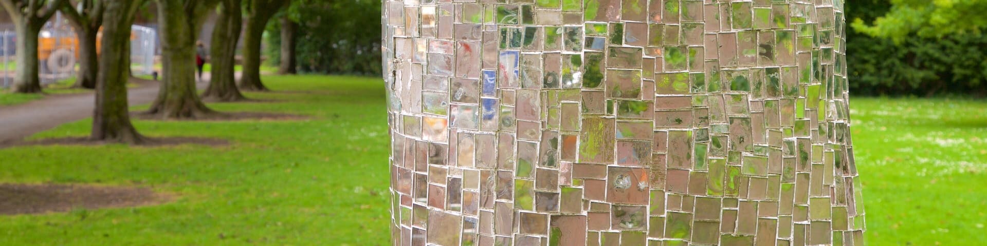 A tree wrapped in mosaic tiles.