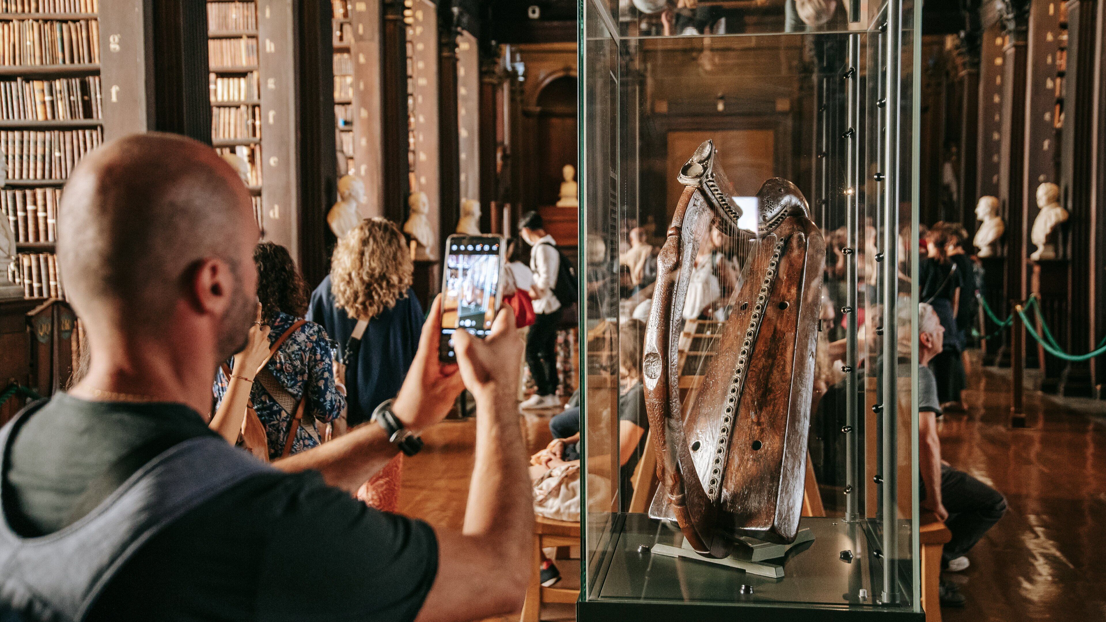 The Book of Kells featuring heritage elements and interior views as well as an individual male
