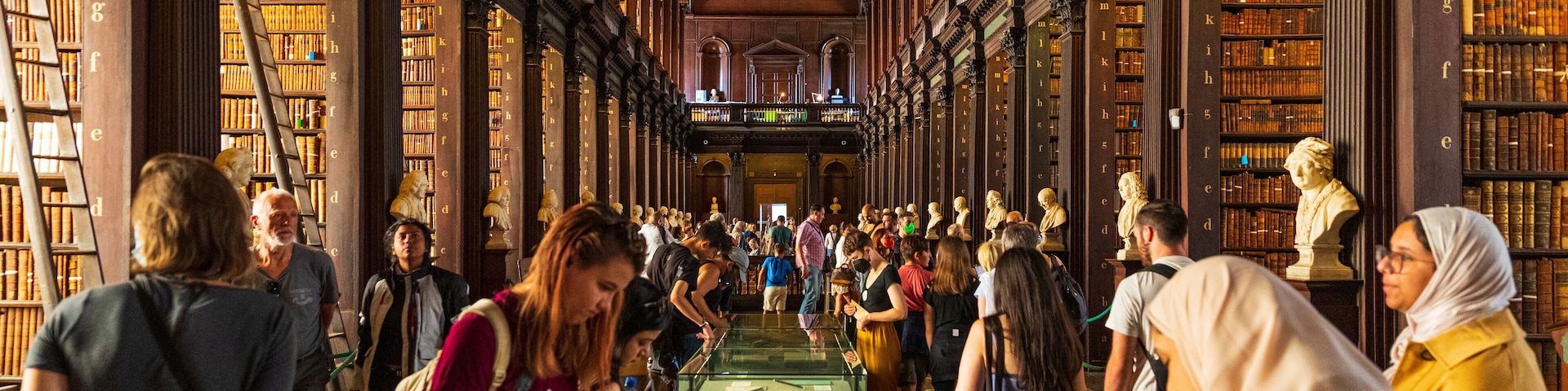 The Book of Kells showing heritage elements and interior views as well as a large group of people