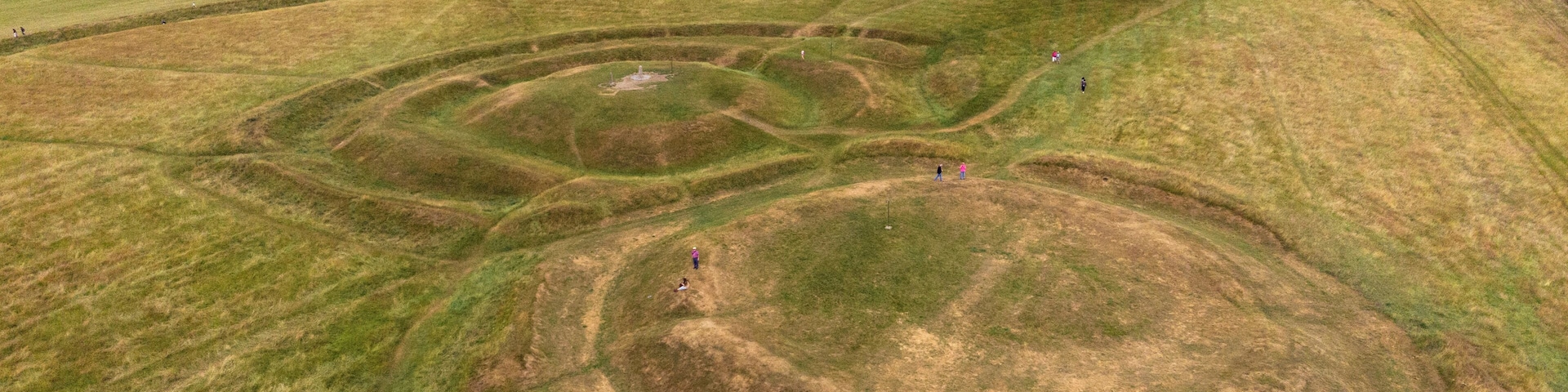 An aerial view of the Hill of Tara located in the Boyne Valley in Ireland. The Hill of Tara was the ancient inauguration site of the High Kings of Ireland. The small mound in the top right of the photo is a passage tomb known as Dumha na nGiall âMount of Hostagesâ and dates from the Neolithic Age around 3,000 BC. #History