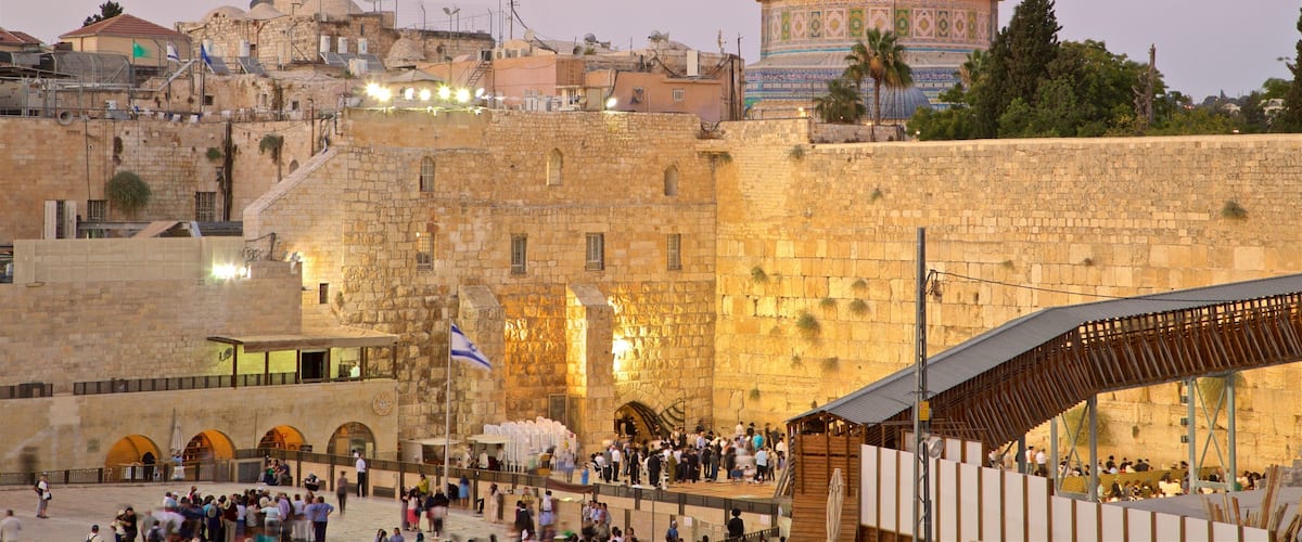Western Wall showing heritage elements, landscape views and a sunset