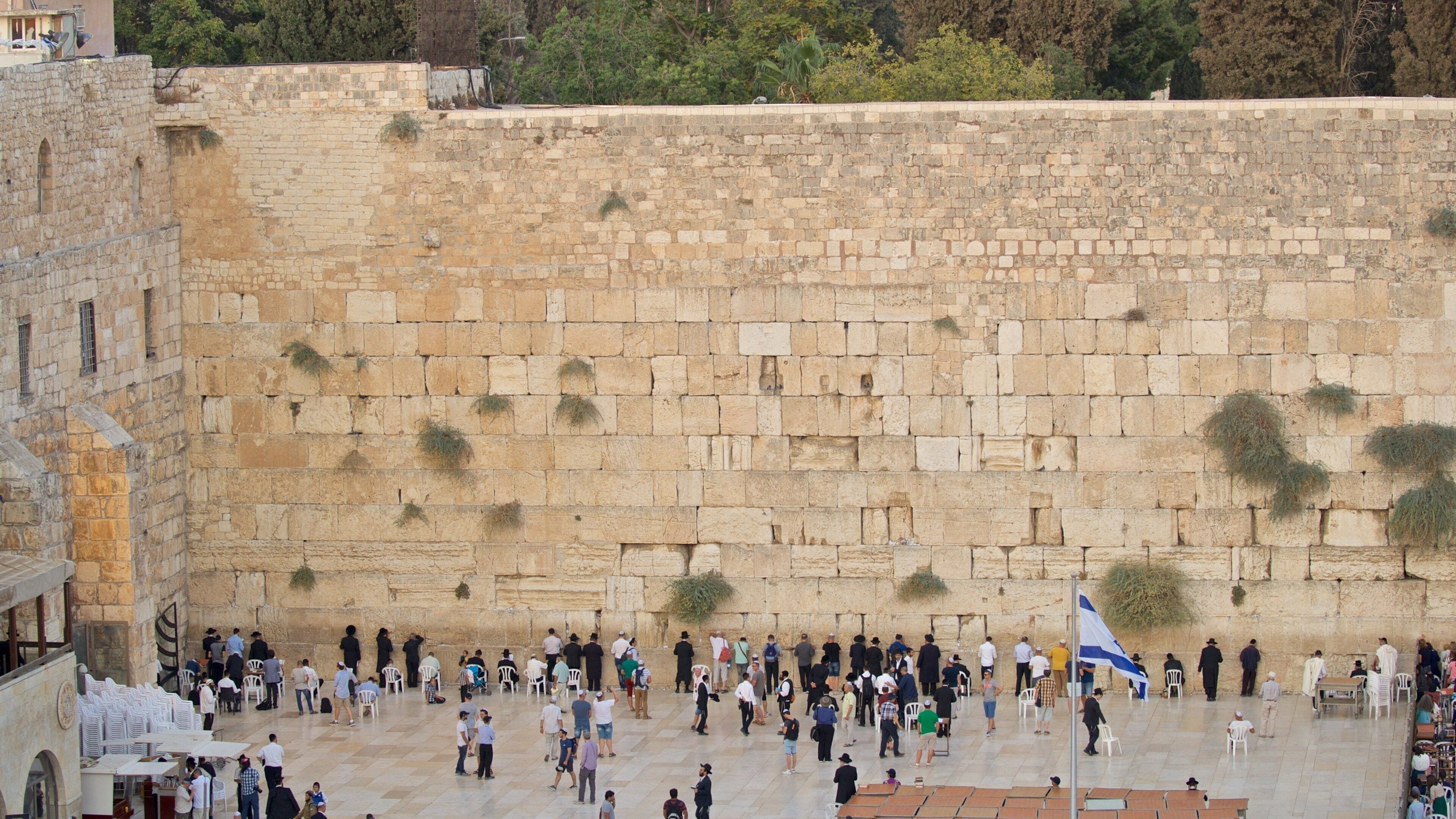 Western Wall showing religious aspects and heritage elements as well as a small group of people