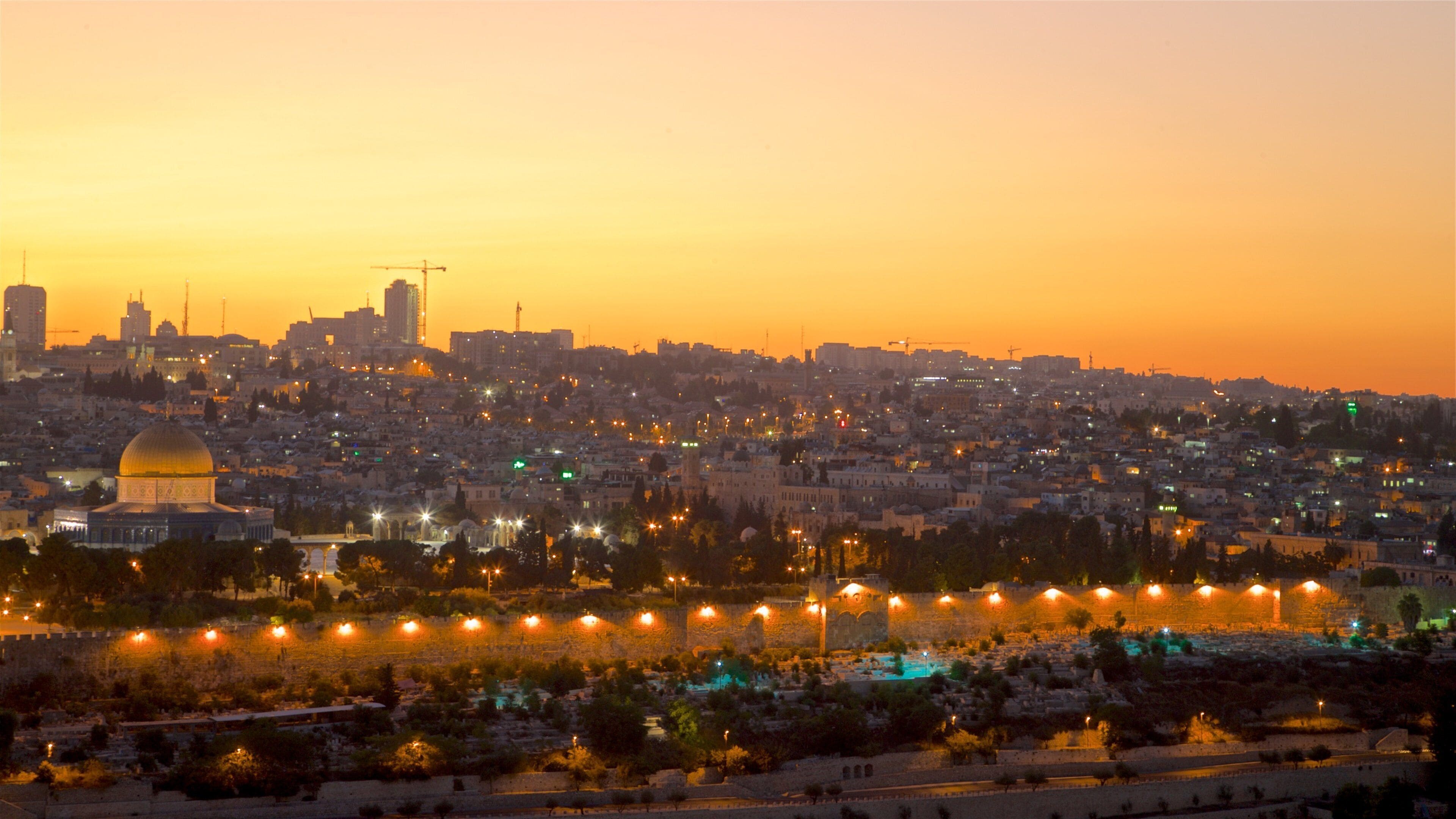 Temple Mount showing a city, a sunset and landscape views
