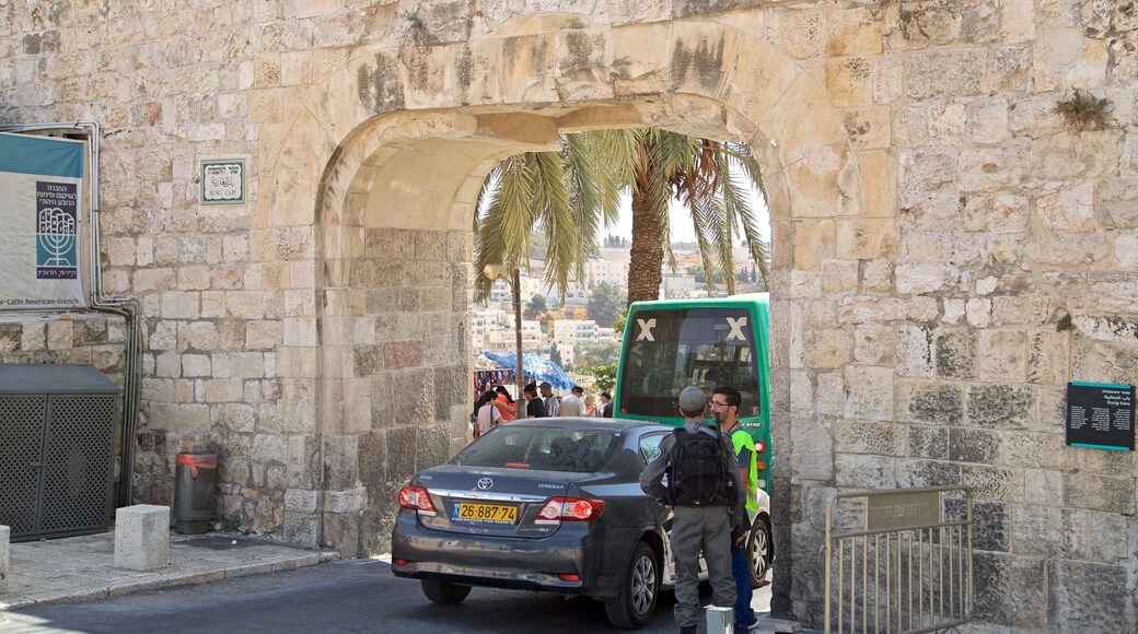 Dung Gate featuring heritage elements as well as a small group of people