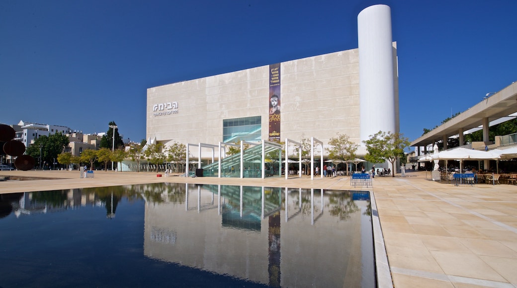 Habima Theatre featuring a pond and a city