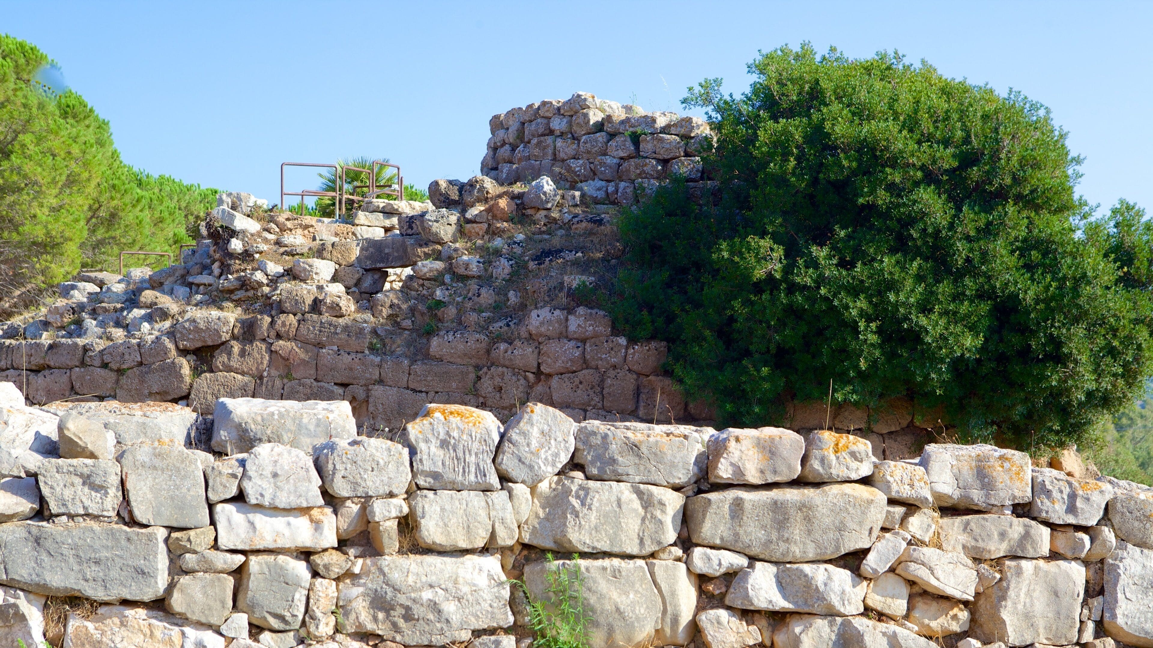 Nuraghe di Palmavera showing building ruins and heritage elements