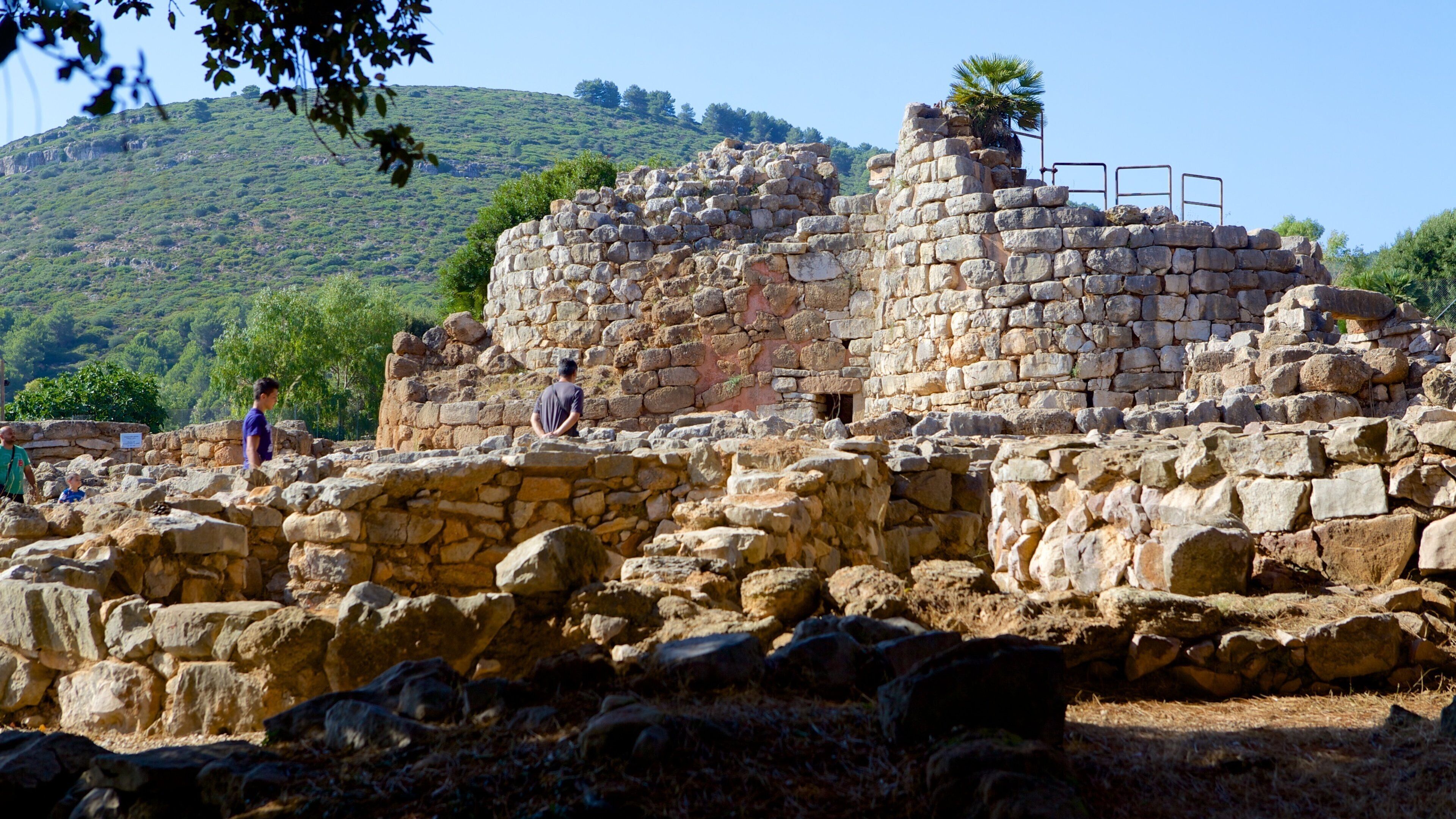 Nuraghe di Palmavera which includes heritage architecture and building ruins