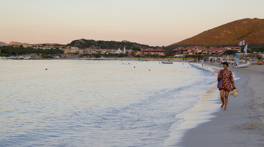La Marinella Beach featuring a sunset, a beach and a coastal town