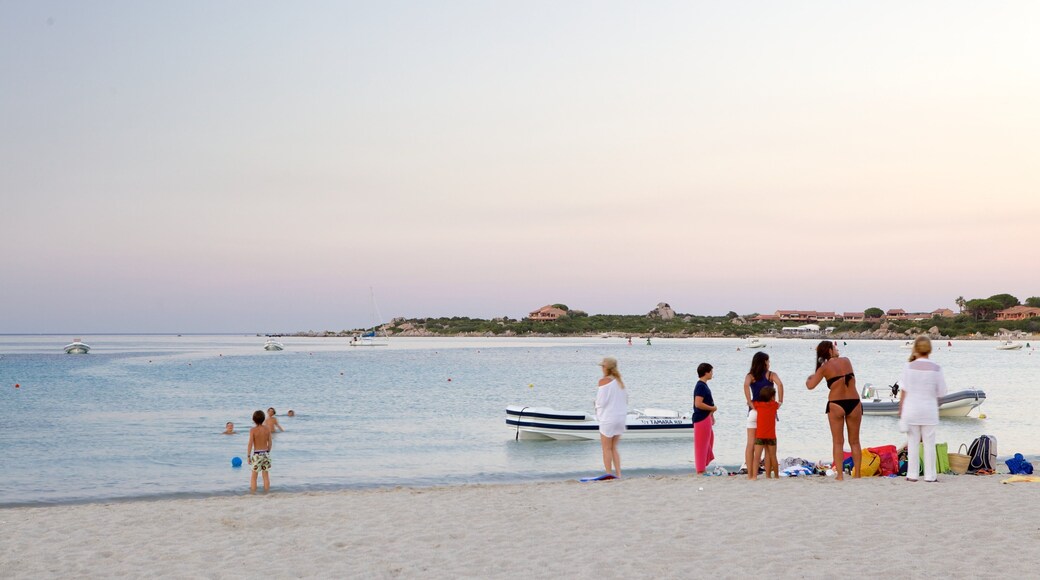 La Marinella Beach which includes general coastal views, a sunset and a beach
