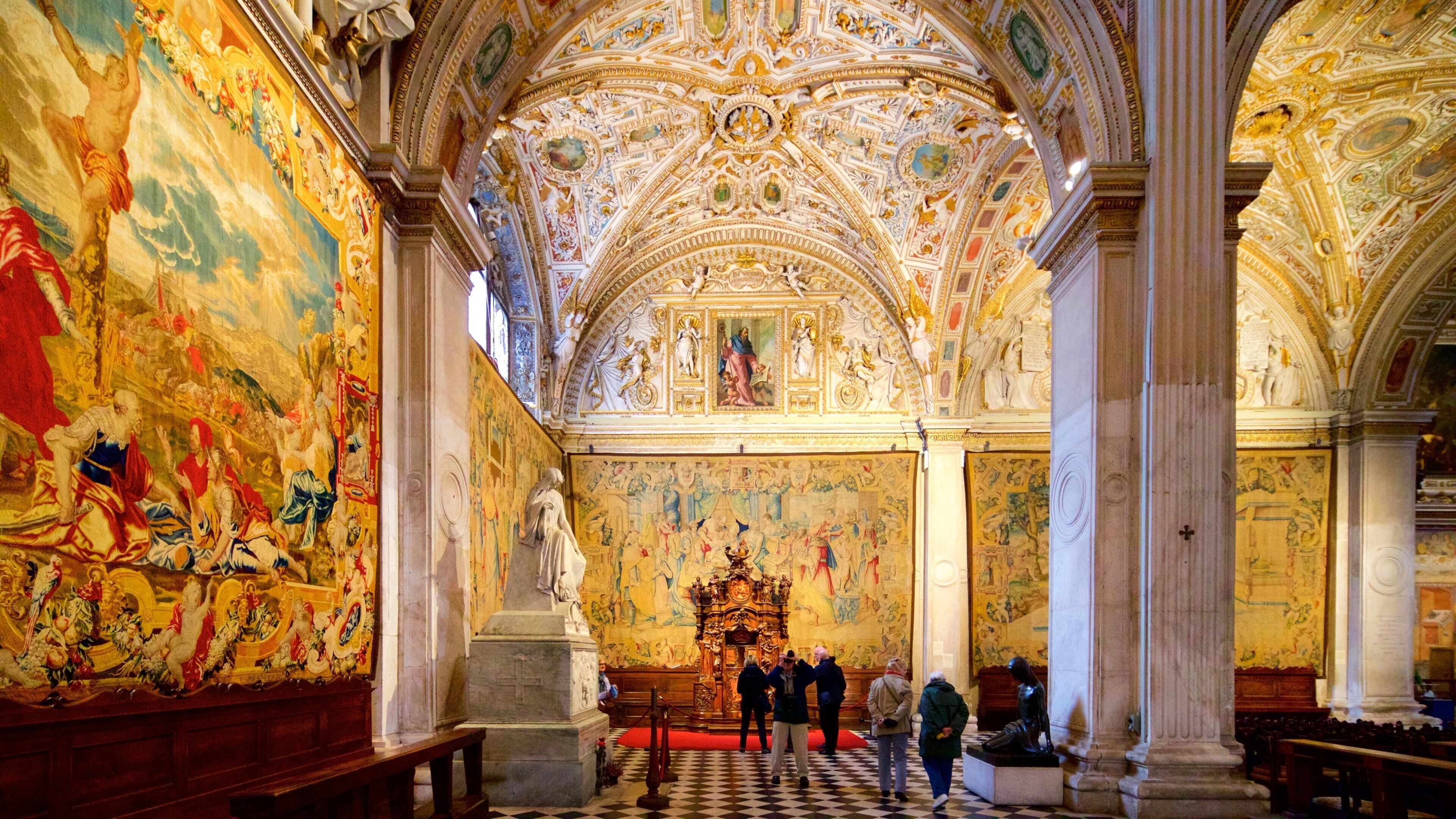 An ornate church interior with detailed frescoes, a high vaulted ceiling, and a central altar.