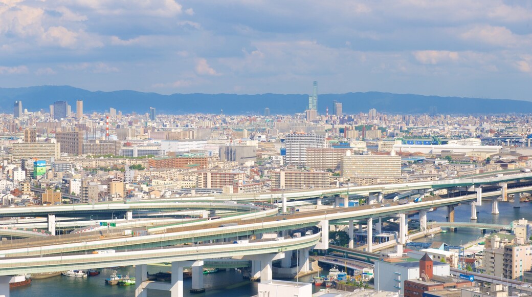 Pariserhjulet i Tempozan havnen som viser by og silhuett