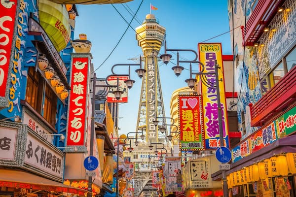 Tsutenkaku Tower showing a city, cbd and signage
