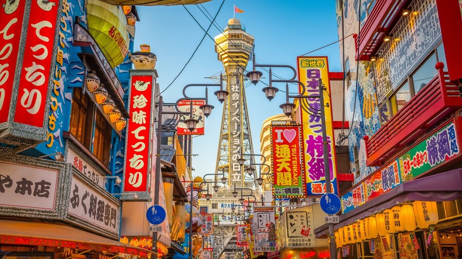Tsutenkaku Tower showing a city, cbd and signage