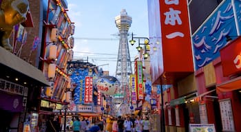 Tsutenkaku Tower featuring a city and street scenes