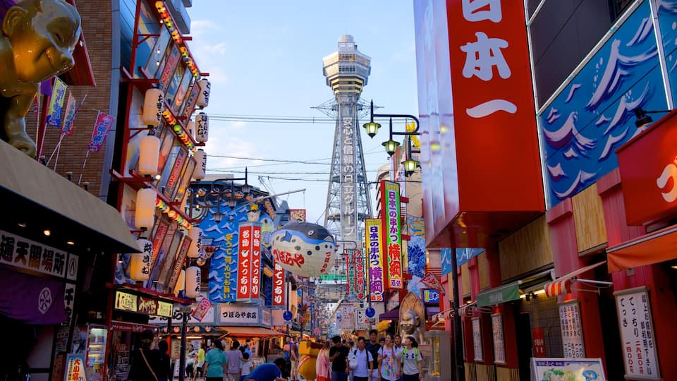 Tsutenkaku Tower featuring a city and street scenes