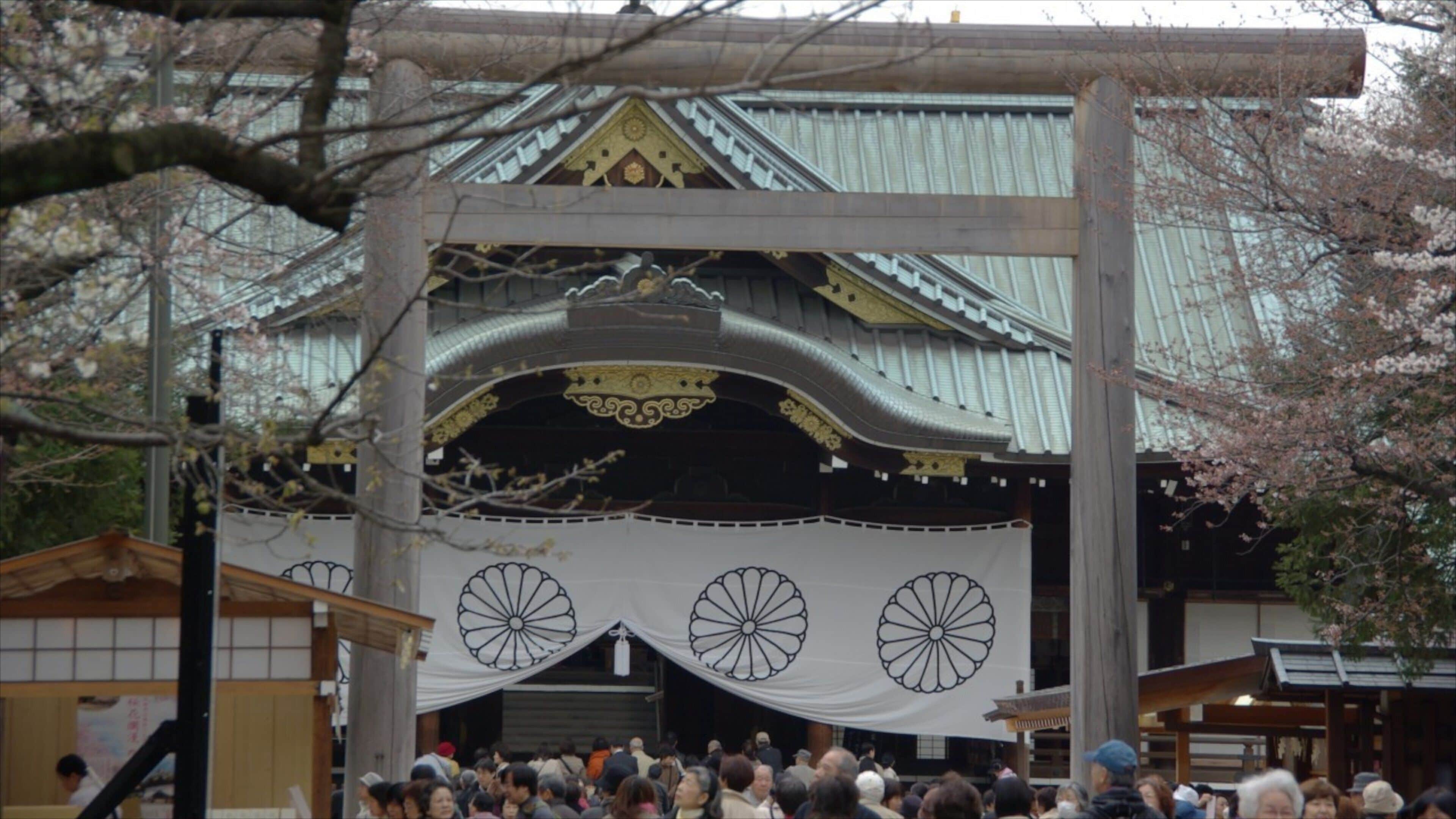 Yasukuni Shrine featuring a temple or place of worship as well as a large group of people