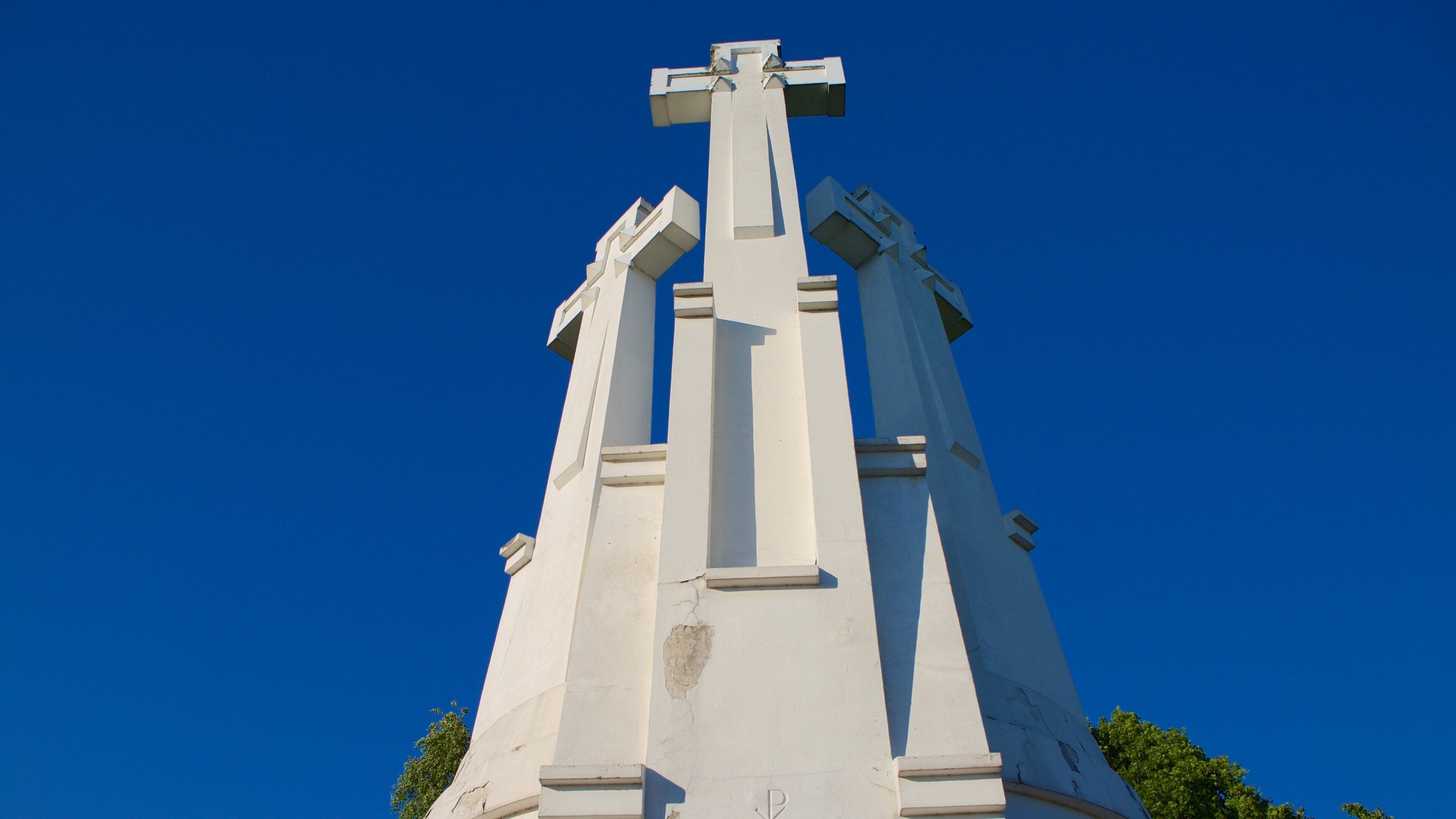 Three Crosses which includes religious elements and a monument