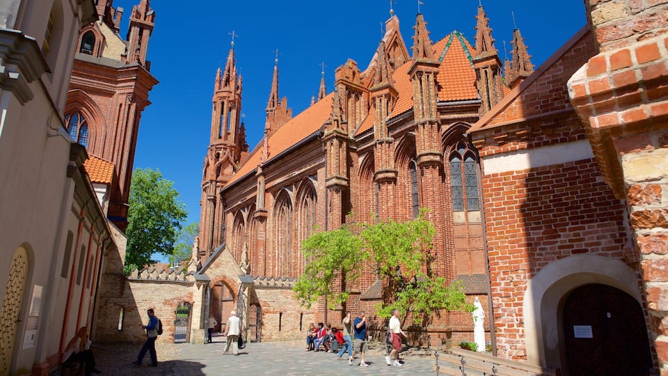 St. Anne\'s Church showing heritage architecture and a church or cathedral as well as a small group of people