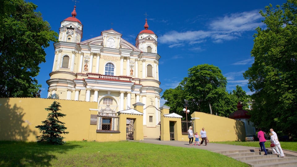 St. Peter and St. Paul\'s Church featuring a church or cathedral and heritage architecture as well as a small group of people