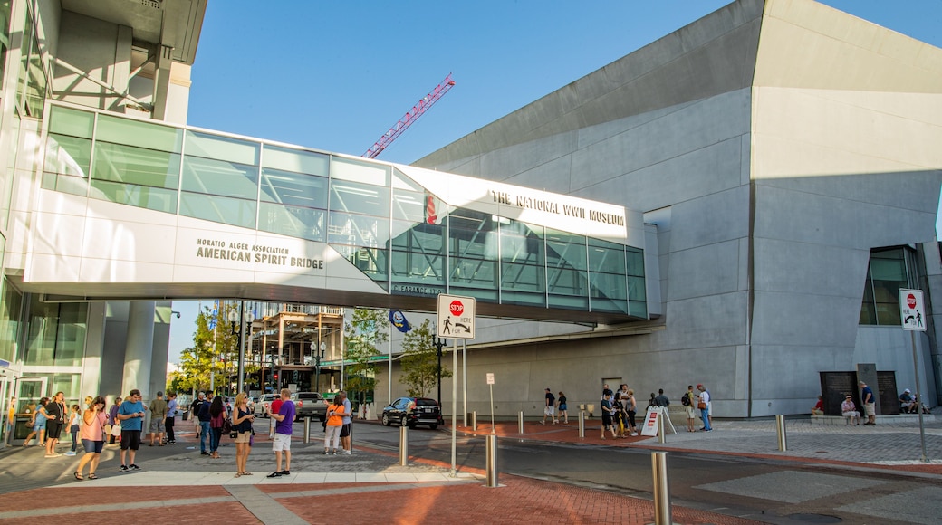 National World War II Museum which includes a city, street scenes and a bridge